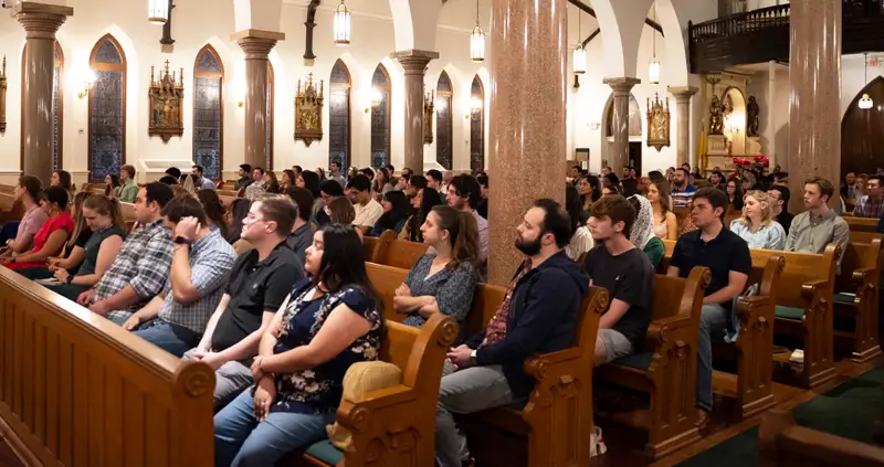 Young Adults worship at Mass.